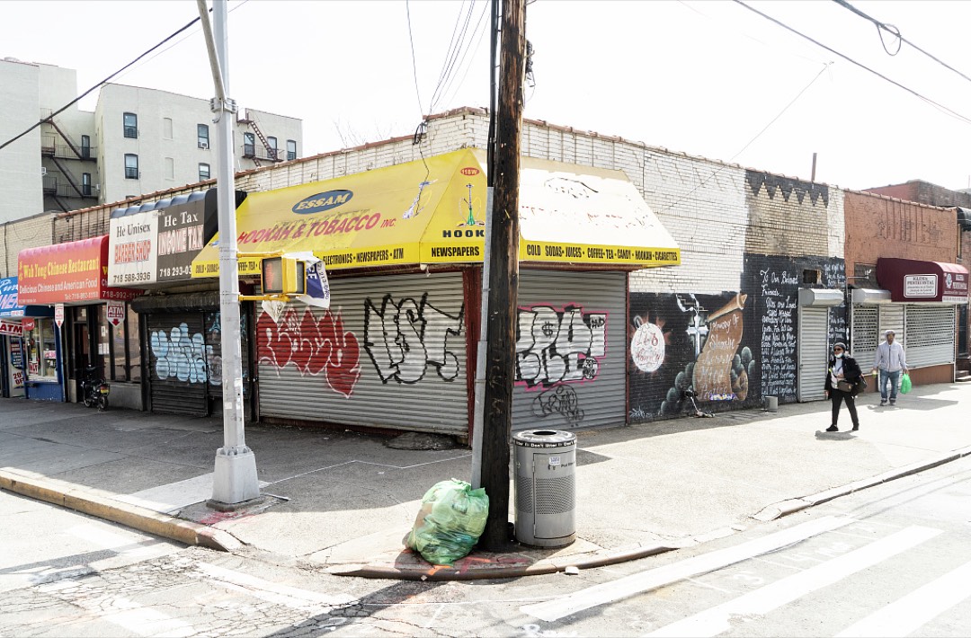 Closed storefronts and masked pedestrians in New York during the pandemic